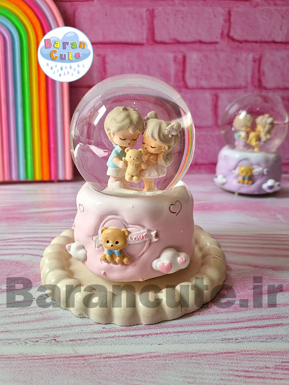 گوی موزیکال برفی چراغ دار (سایز متوسط) طرح دختر و پسر کیوت صورتی